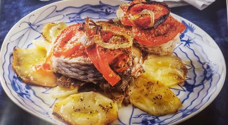 Salmon baked with potatoes and tomatoes
